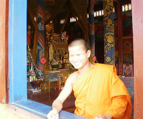monk at wat kraom in sihanoukville, cambodia